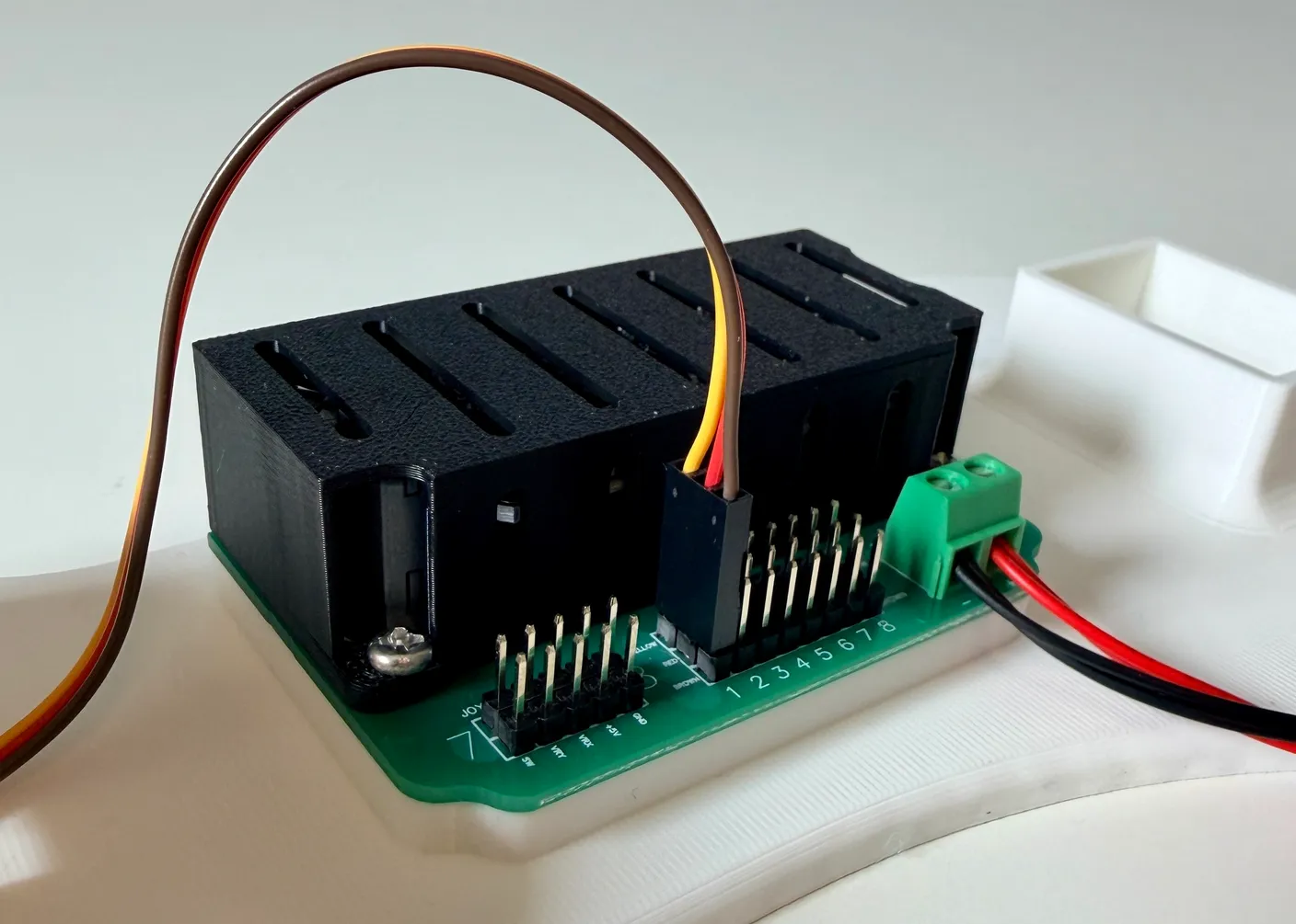 Robotic Arm build — Start with the Base: Plug the servo’s wire into the circuit board.