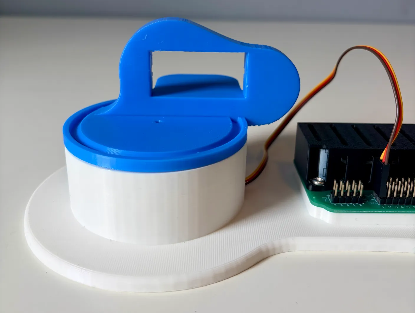 Robotic Arm build — Assemble the First Half of the Arm: Connect the blue part to the servo as shown above.