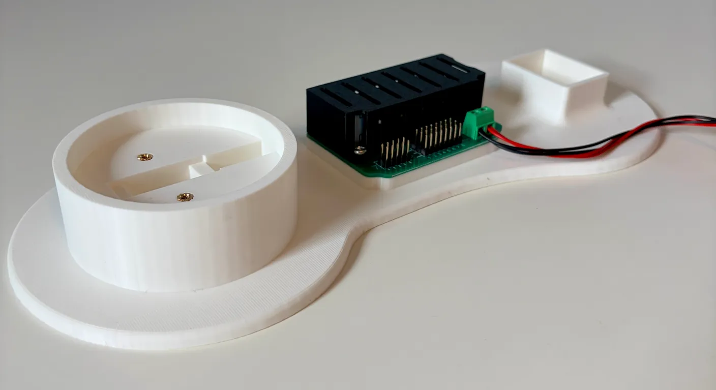 Robotic Arm build — Start with the Base: Find the big white base with the circuit board on it.