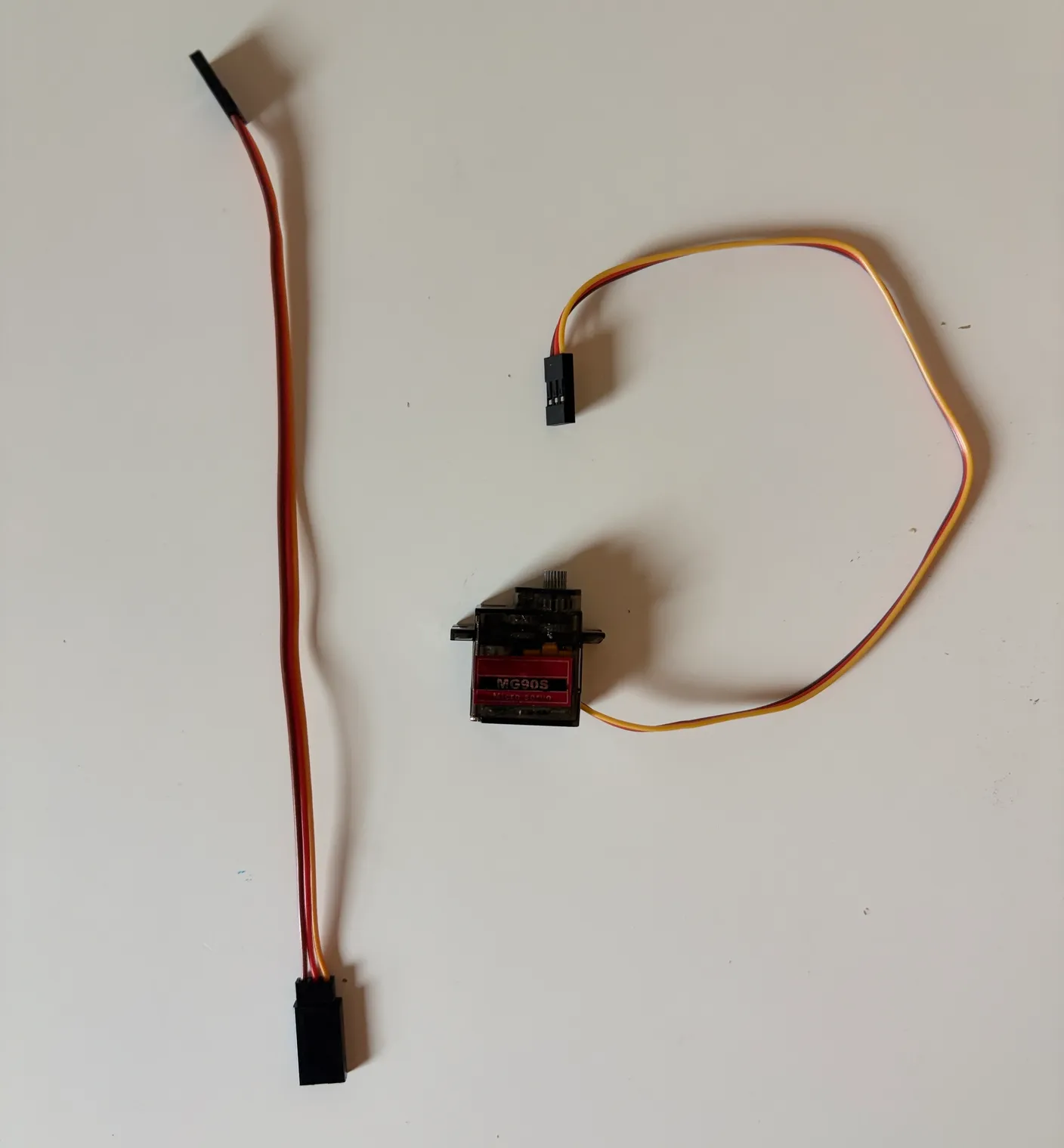 Robotic Arm build — Assemble the Other Half of the Arm: Get another servo and the first of three servo wire extenders.