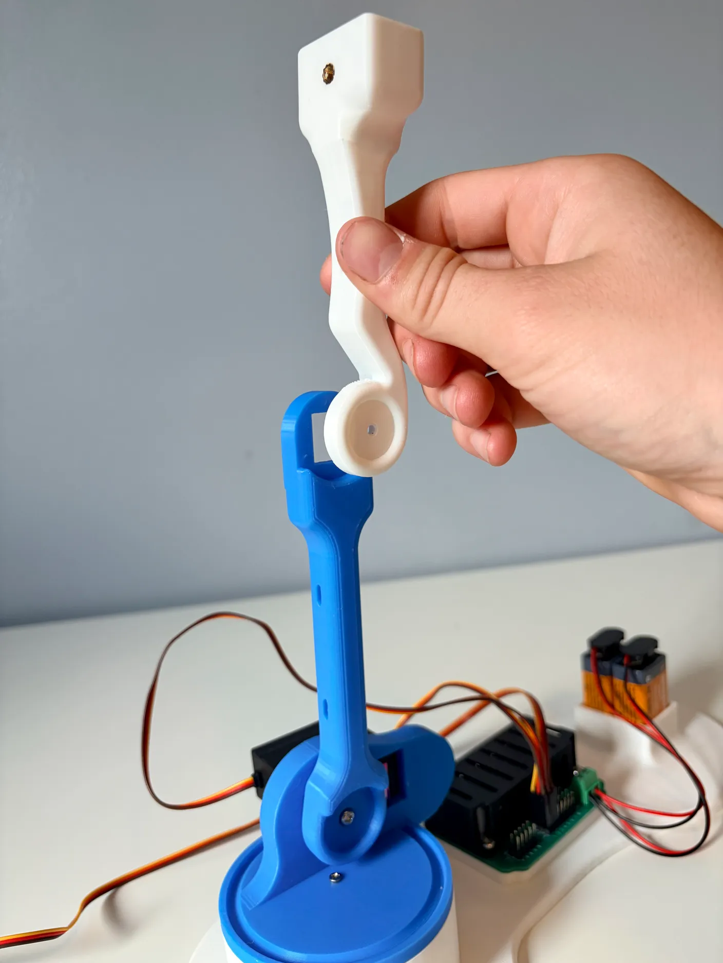 Robotic Arm build — Assemble the Other Half of the Arm: Orient the servo into the blue arm as shown above.