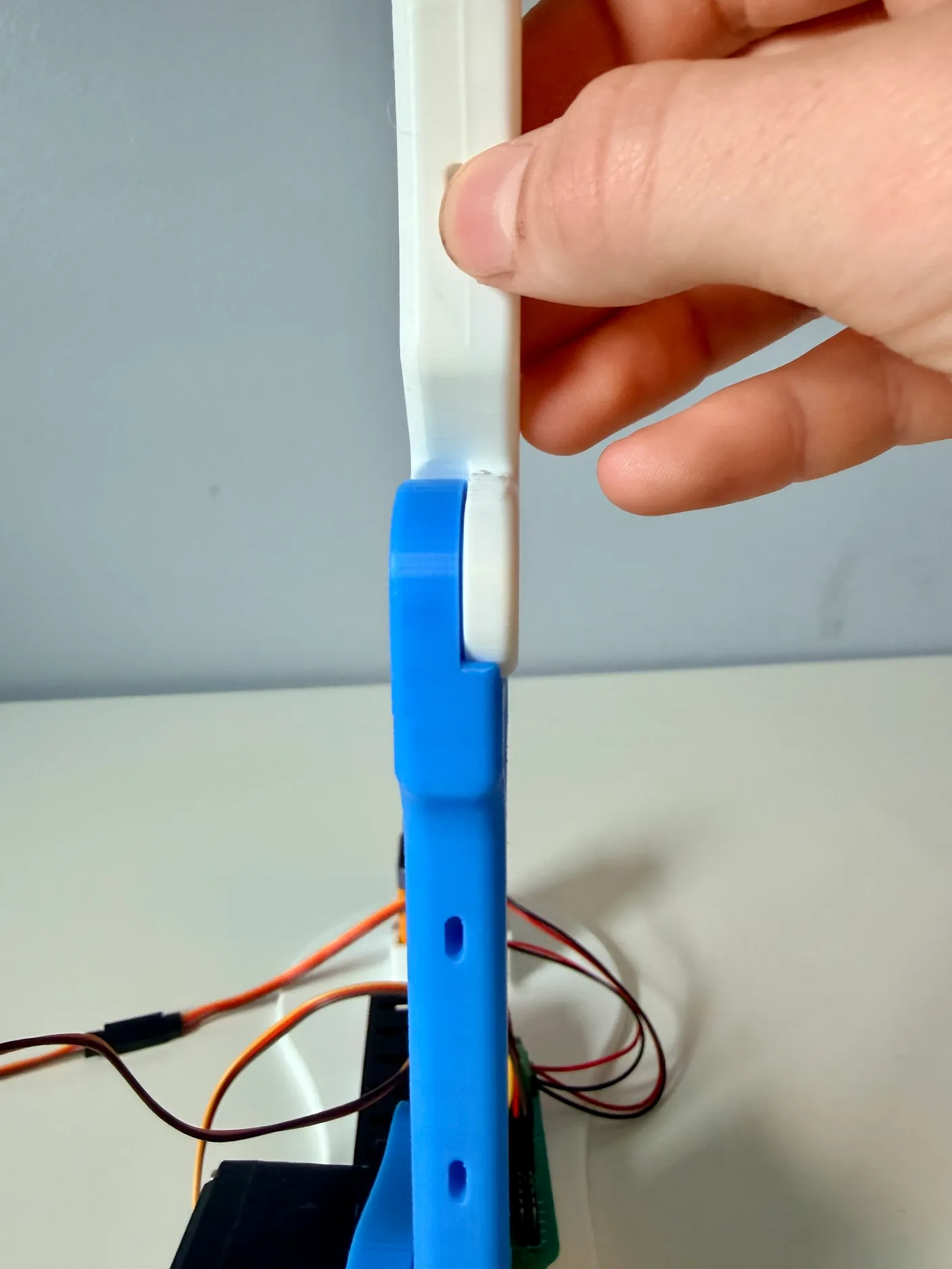 Robotic Arm build — Assemble the Other Half of the Arm: Get the white arm piece, pointing straight up like the image.