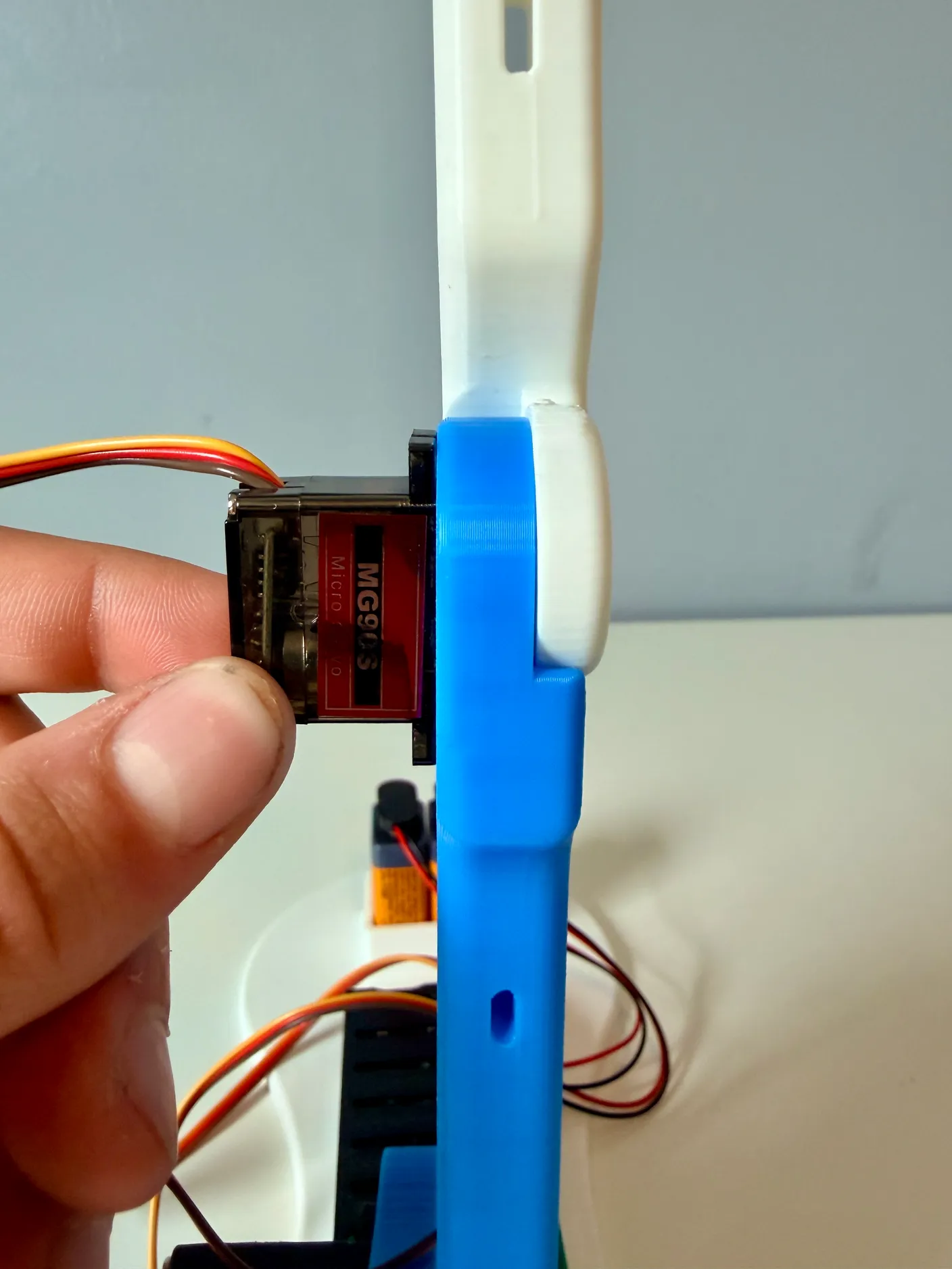 Robotic Arm build — Assemble the Other Half of the Arm: Snap the arm onto the servo the same way as the others.