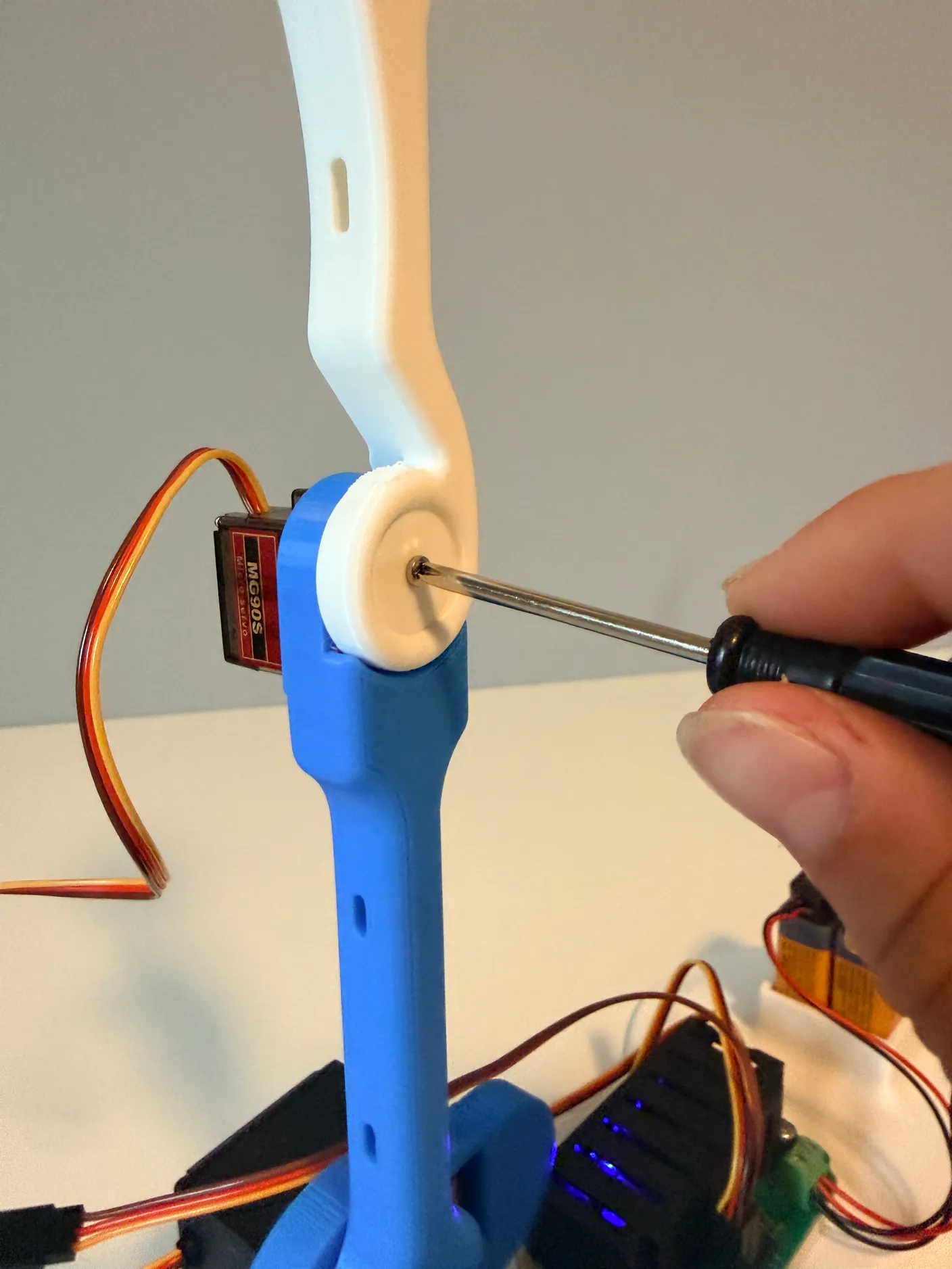 Robotic Arm build — Assemble the Other Half of the Arm: Tighten the arm with another small screw from the servo bag.