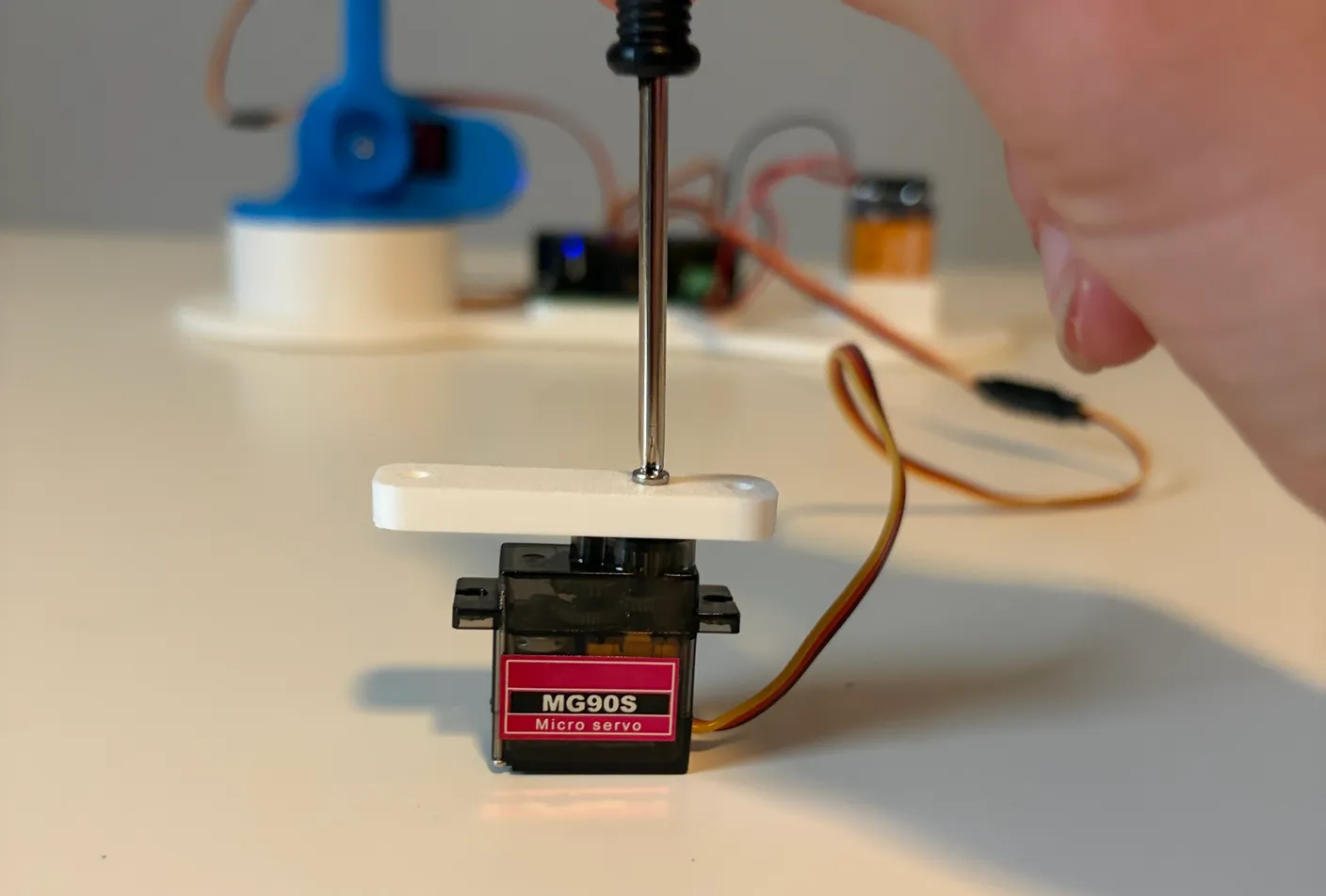 Robotic Arm build — Assemble the Other Half of the Arm: Tighten it with another small screw from the servo screw bags.
