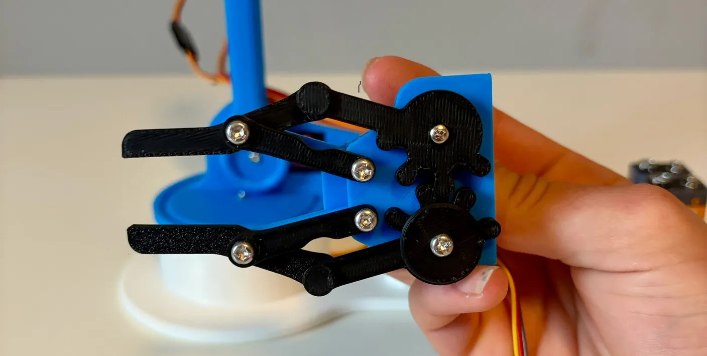 Robotic Arm build — Attach the Gripper: Now attach the gripper — the part that interacts with the world.