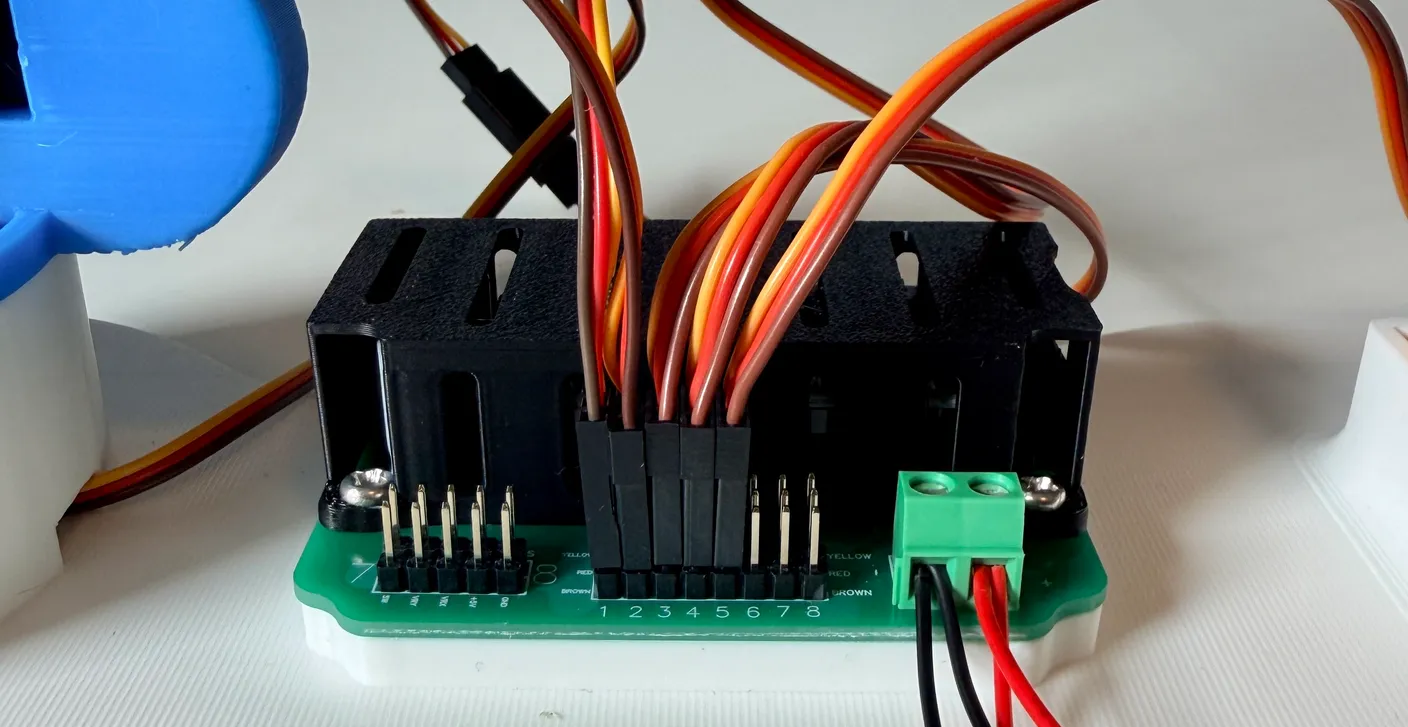 Robotic Arm build — Attach the Gripper: Plug it into column 5, keeping the same color orientation as the other wires.