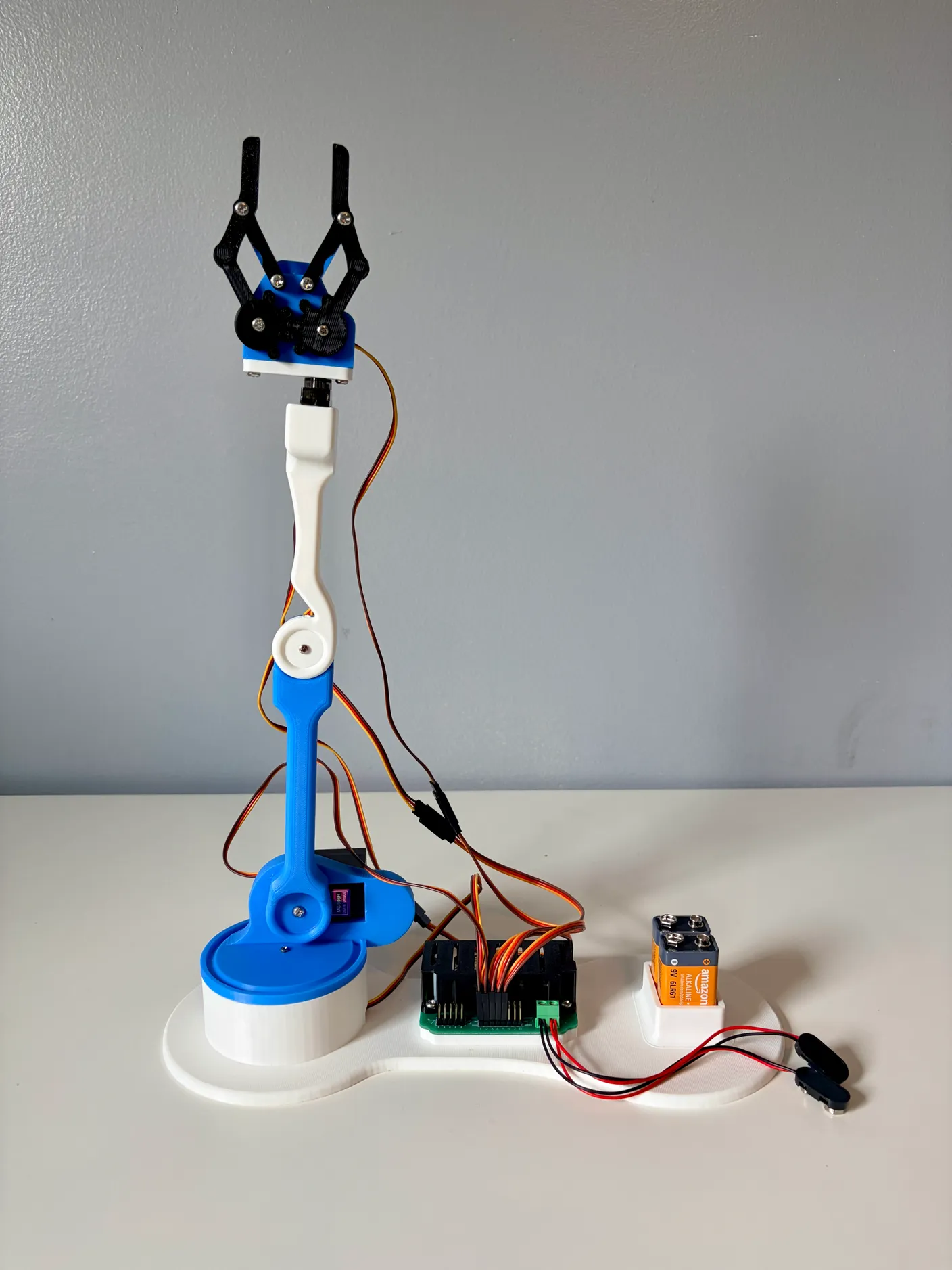 Robotic Arm build — Attach the Gripper: With the gripper screwed on, the build is finished — next comes wiring and controls.