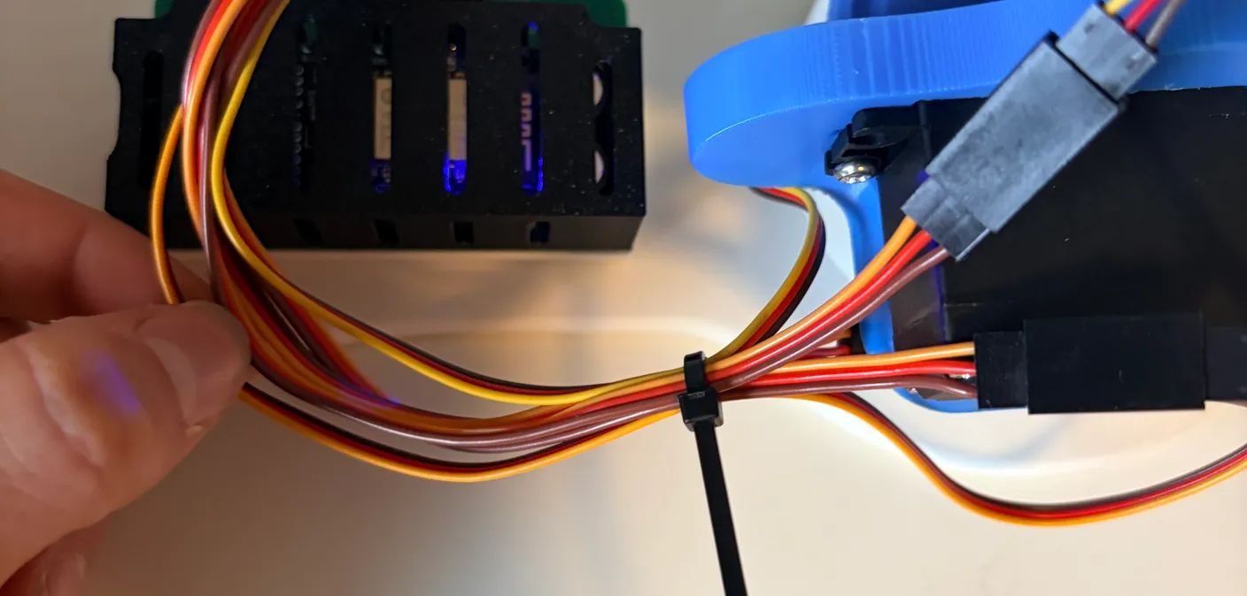 Robotic Arm build — Wire Management: Gather the wires near the big servo with a loose zip tie, then snip the ends carefully.