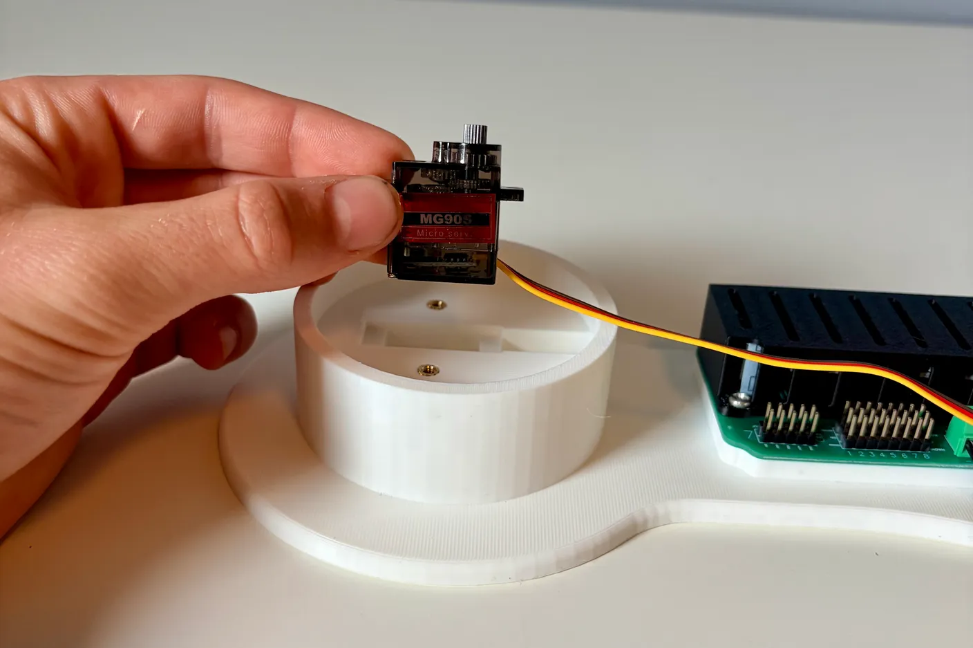Robotic Arm build — Start with the Base: Orient the servo over the base like this.