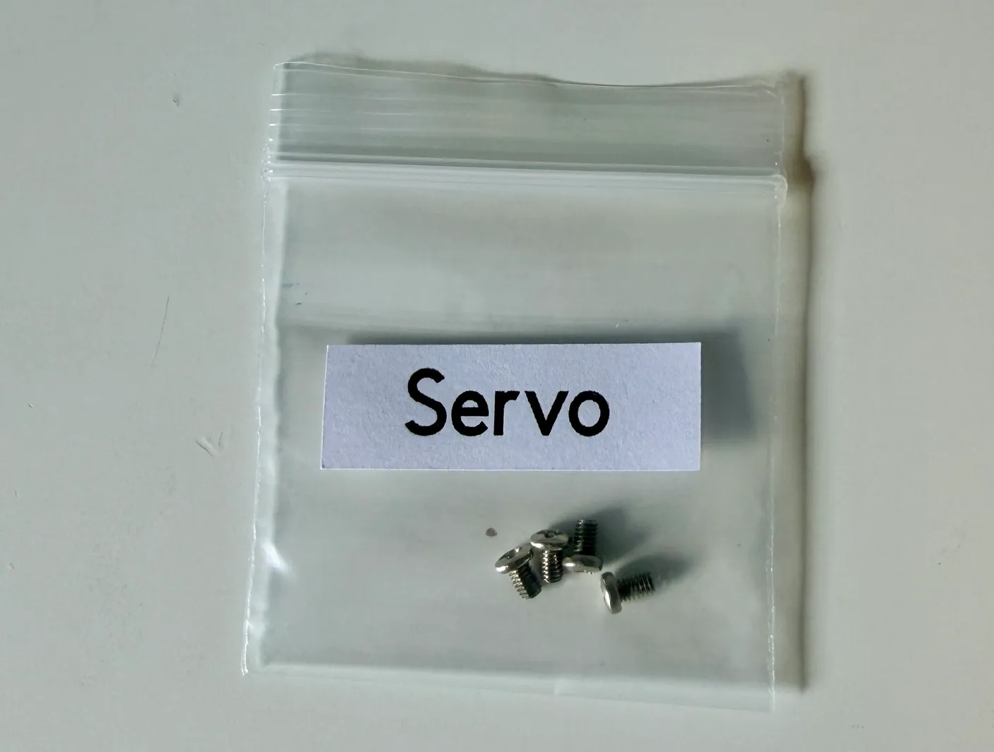 Robotic Arm build — Start with the Base: Find the bag labeled Servo, containing the small screws you’ll use to attach the servos to the robot.