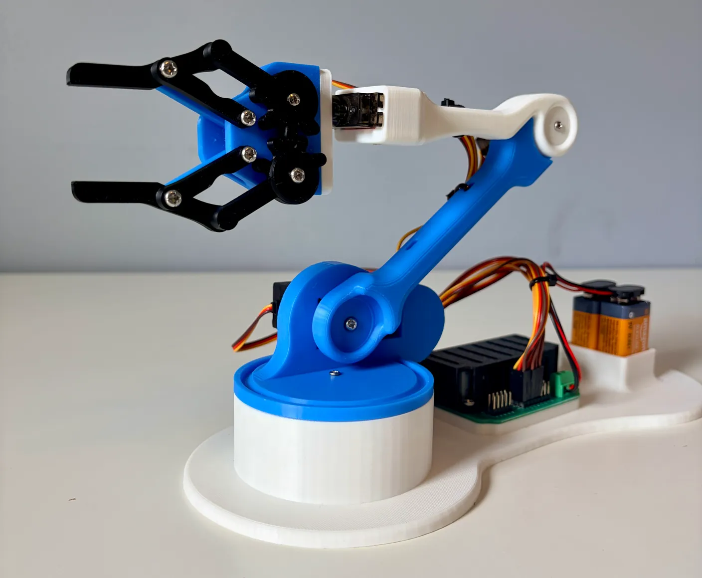 Robotic Arm build — Wire Management: The finished robot arm with all the wires neatly tied.