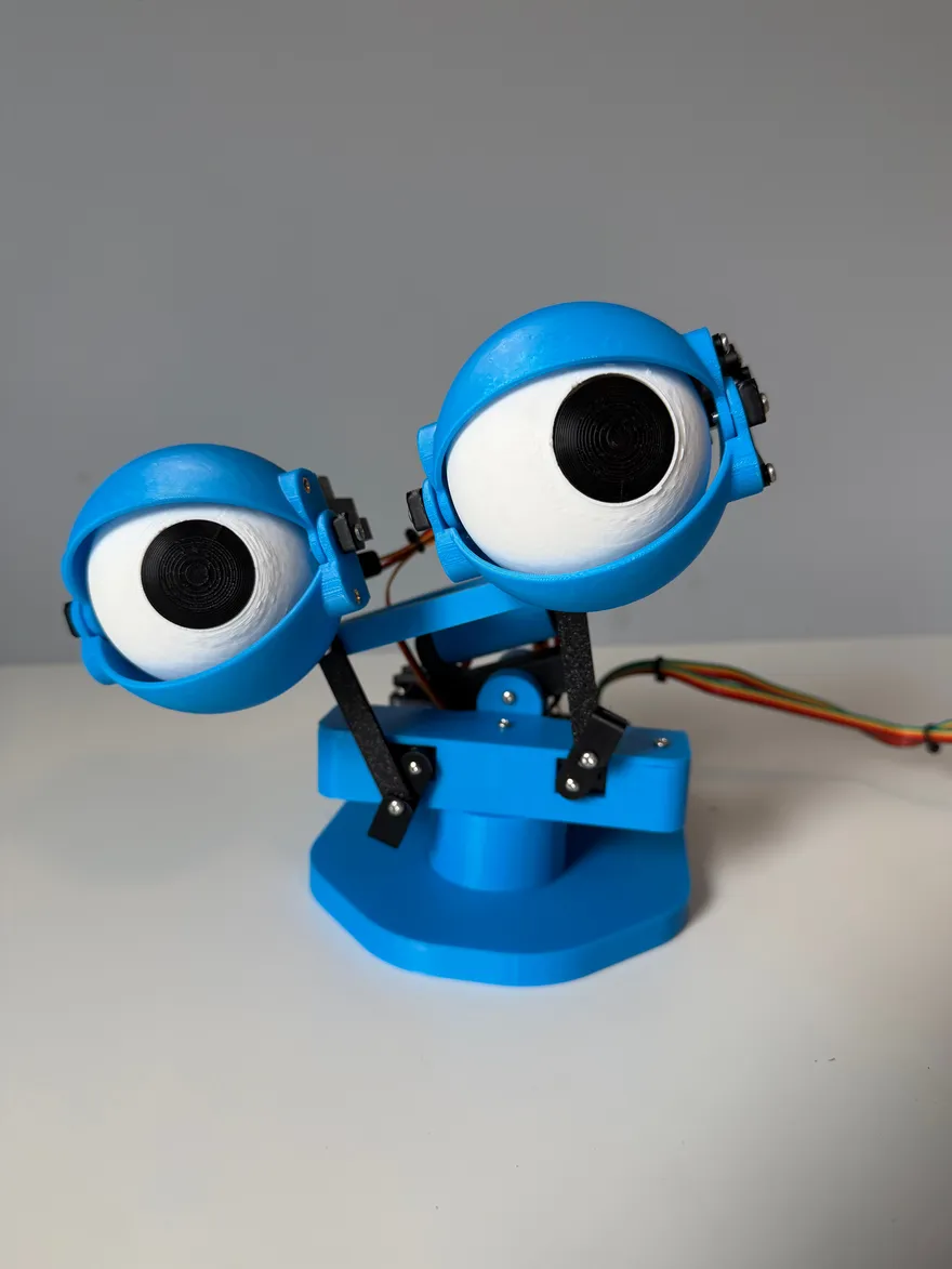 Fully assembled Robotic Eyes animatronic kit with blue 3D-printed parts, dual joystick controller, and Arduino electronics