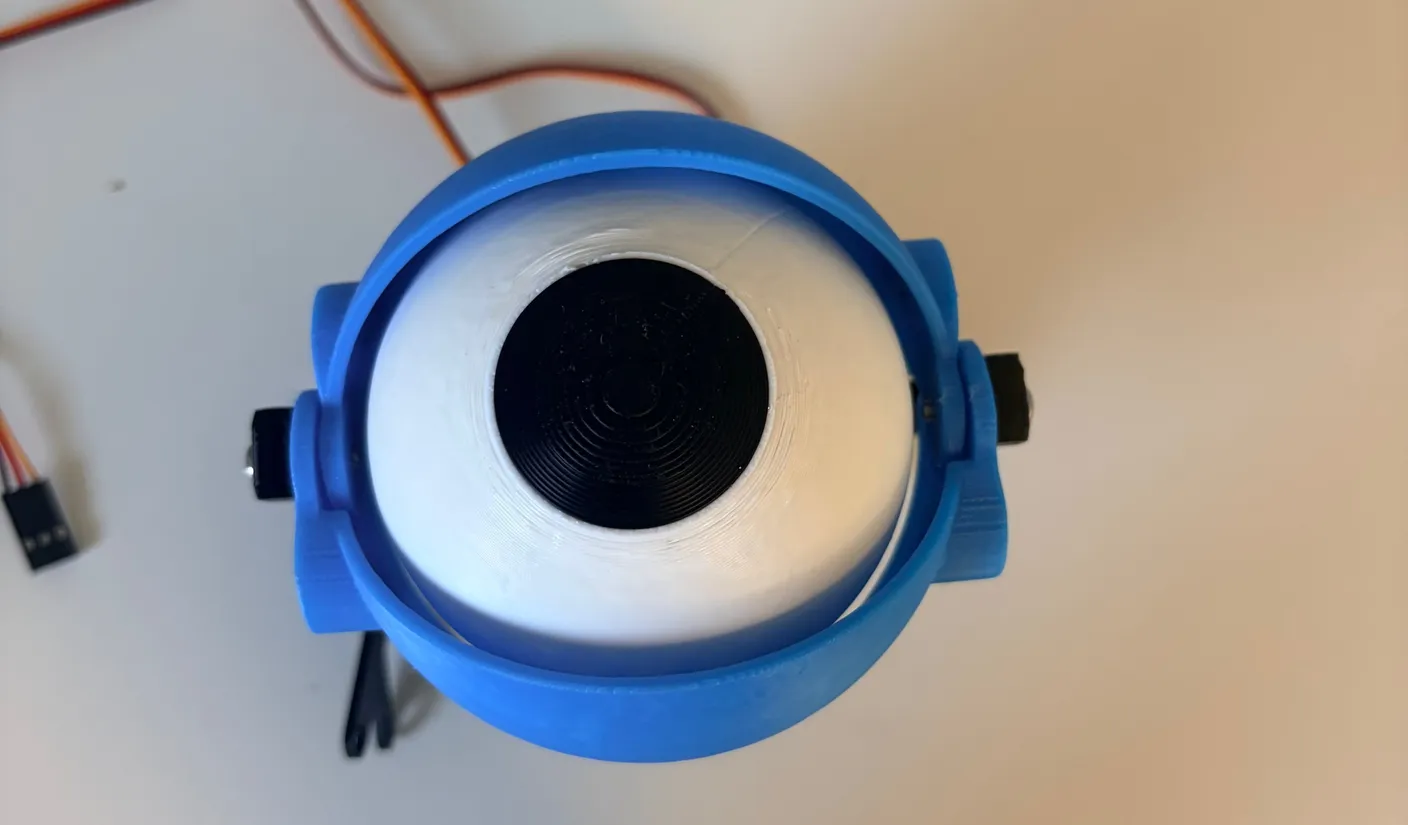 Robotic Eyes build — Assemble the Eyes: Once you tighten the screws, they will hold the eyelids in place, and the eyelids should be able to move freely.