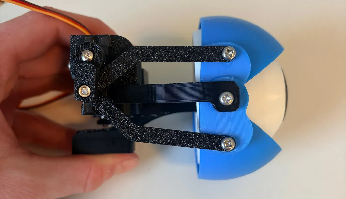 Robotic Eyes build — Assemble the Eyes: Now, using two 6mm screws, connect the push rods to the eyelids, as shown below.