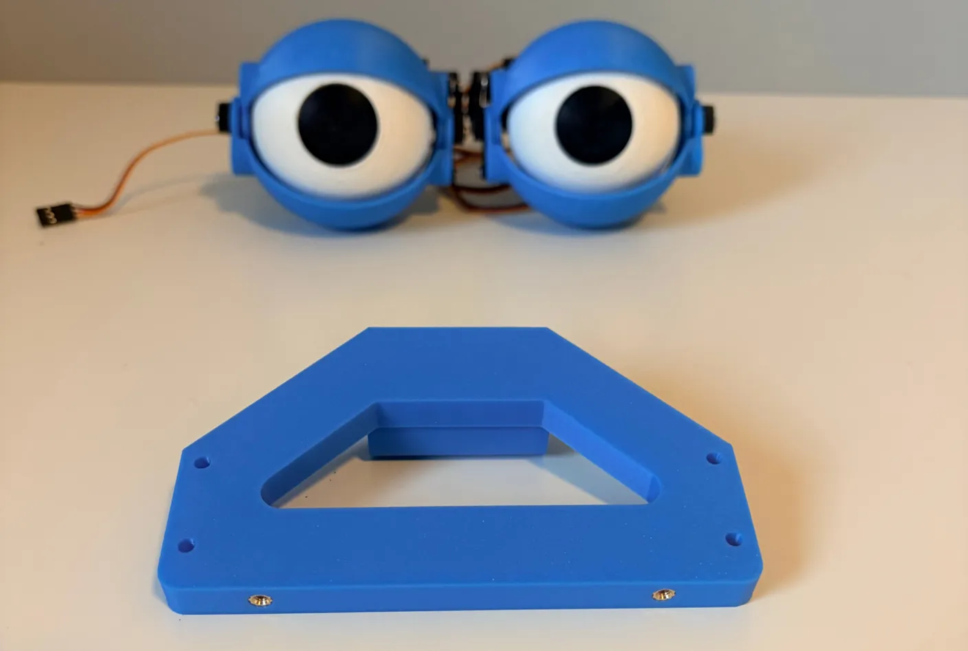 Robotic Eyes build — Assemble the Neck: Now that you have two finished eyes, it’s time to attach them to the part that moves up and down and left and right—the neck.