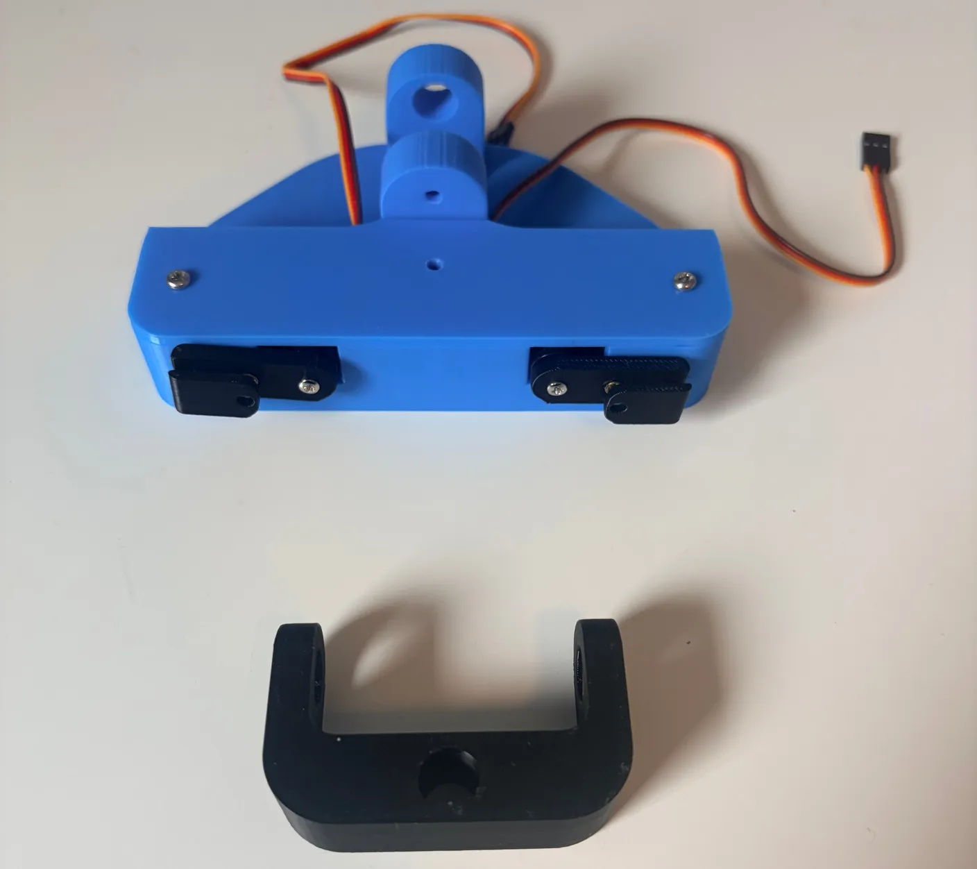 Robotic Eyes build — Assemble the Neck: Now we will connect the finished eye assembly to the part that will move it in all directions.