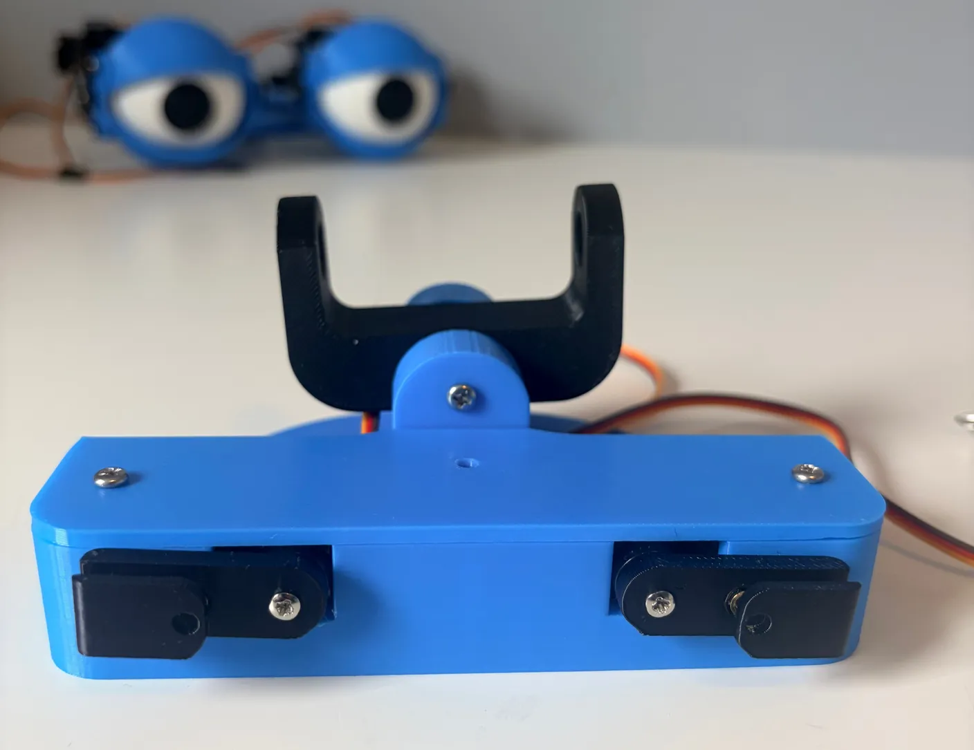 Robotic Eyes build — Assemble the Neck: Once it is all assembled, it should look like the image below, and the black joint should be able to rotate easily.
