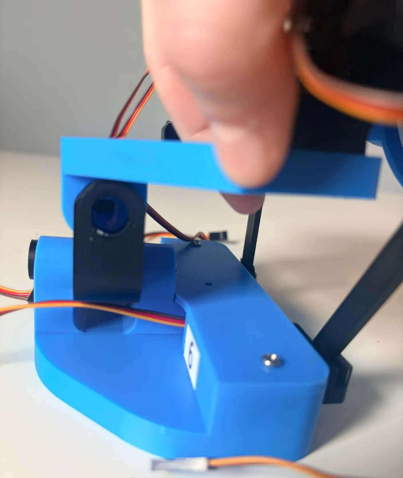 Robotic Eyes build — Assemble the Neck: Once all of that is in place, you can now attach the assembled eyes.