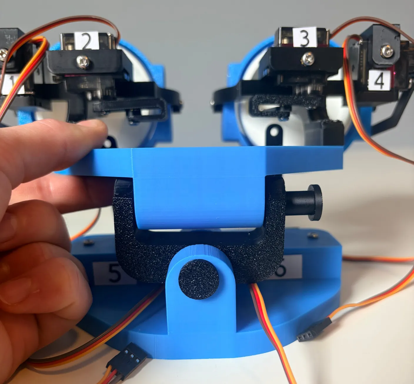 Robotic Eyes build — Assemble the Neck: Now, use the long pin to connect the joint.