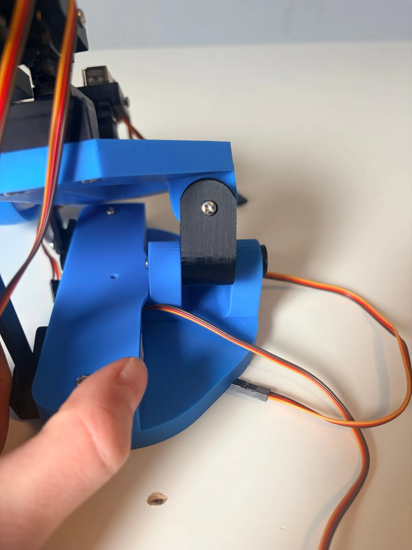 Robotic Eyes build — Assemble the Neck: Secure this pin with a 6mm screw so that it can’t fall out, as shown below.
