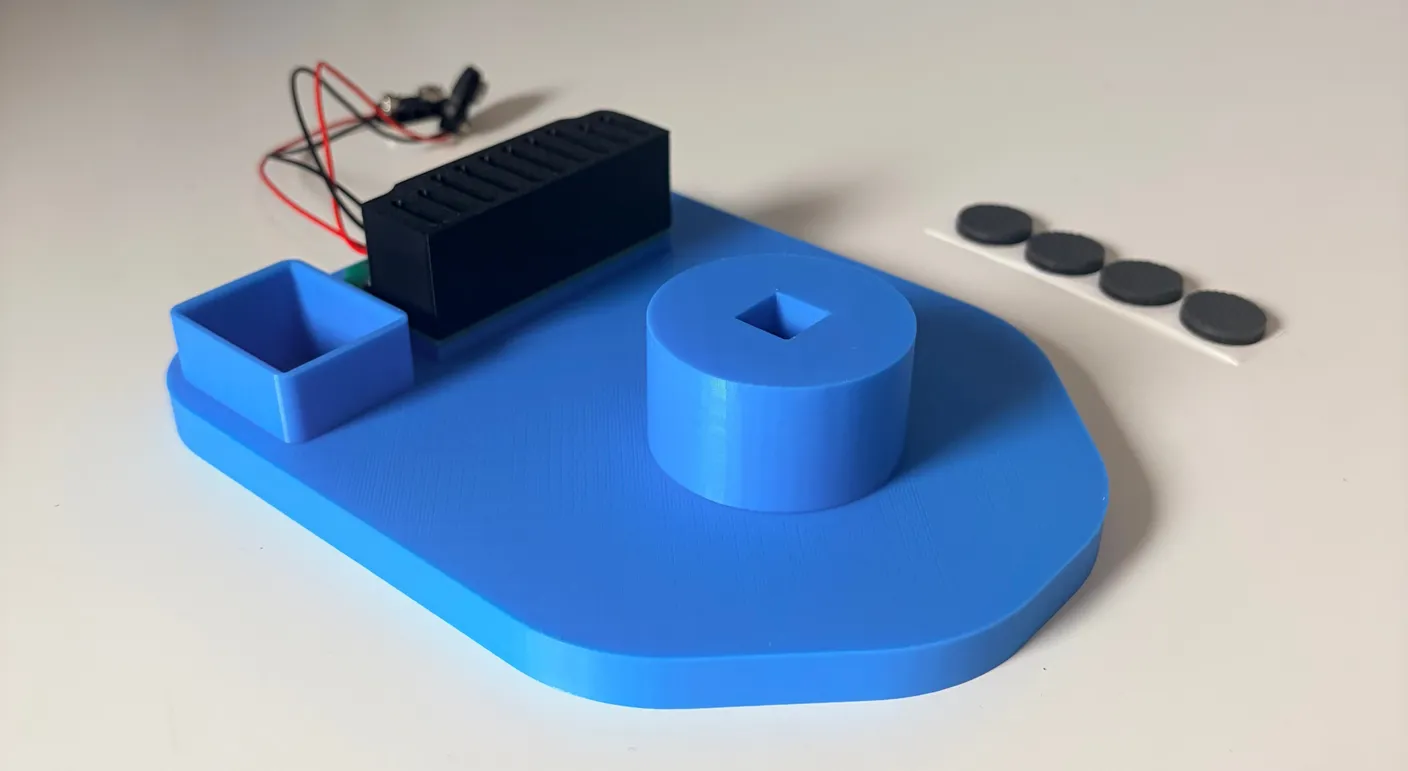 Robotic Eyes build — Assemble the Base: Now, get the big base and the four adhesive rubber pads.