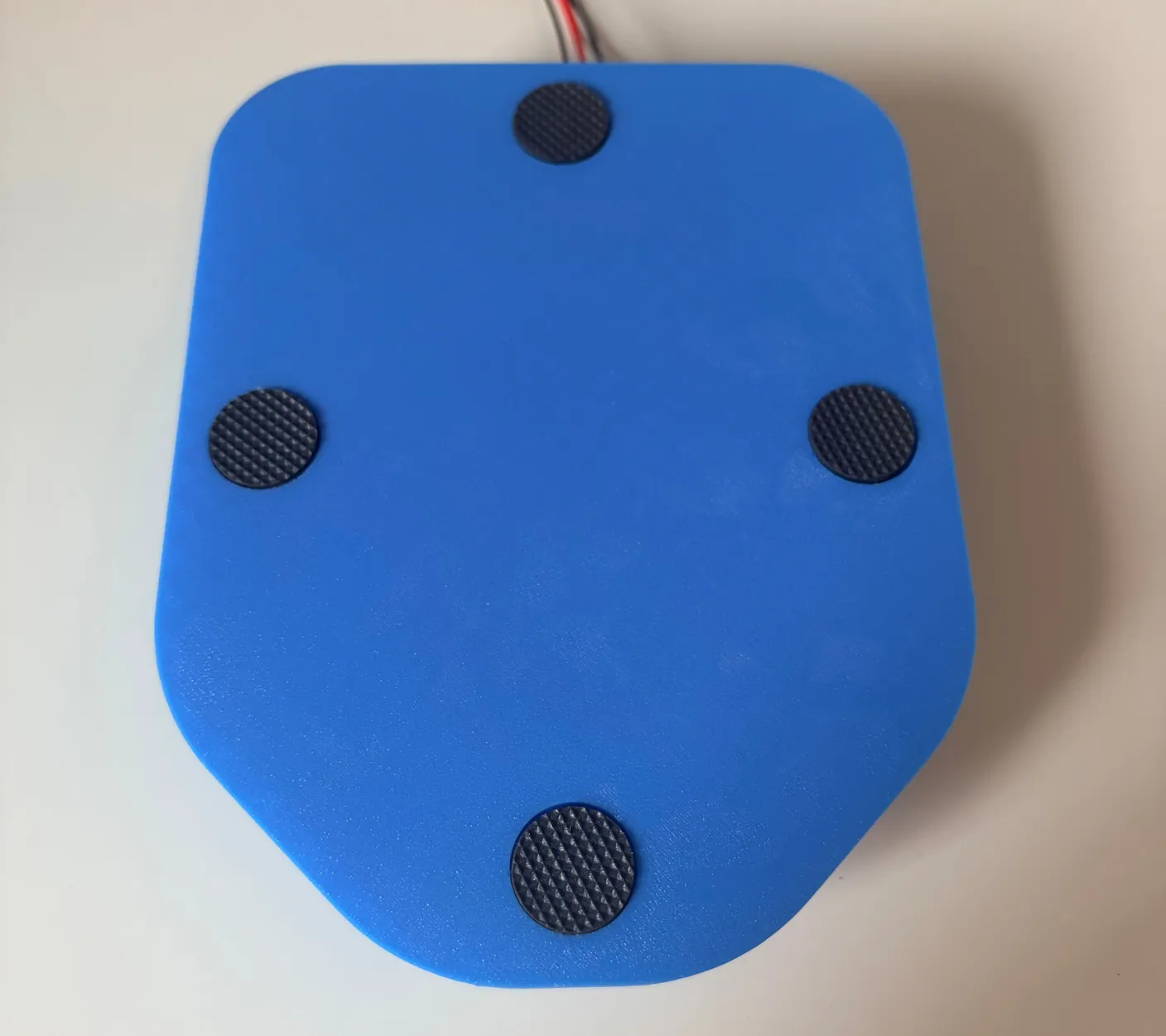 Robotic Eyes build — Assemble the Base: Put the sticky pads in the circles, as shown.