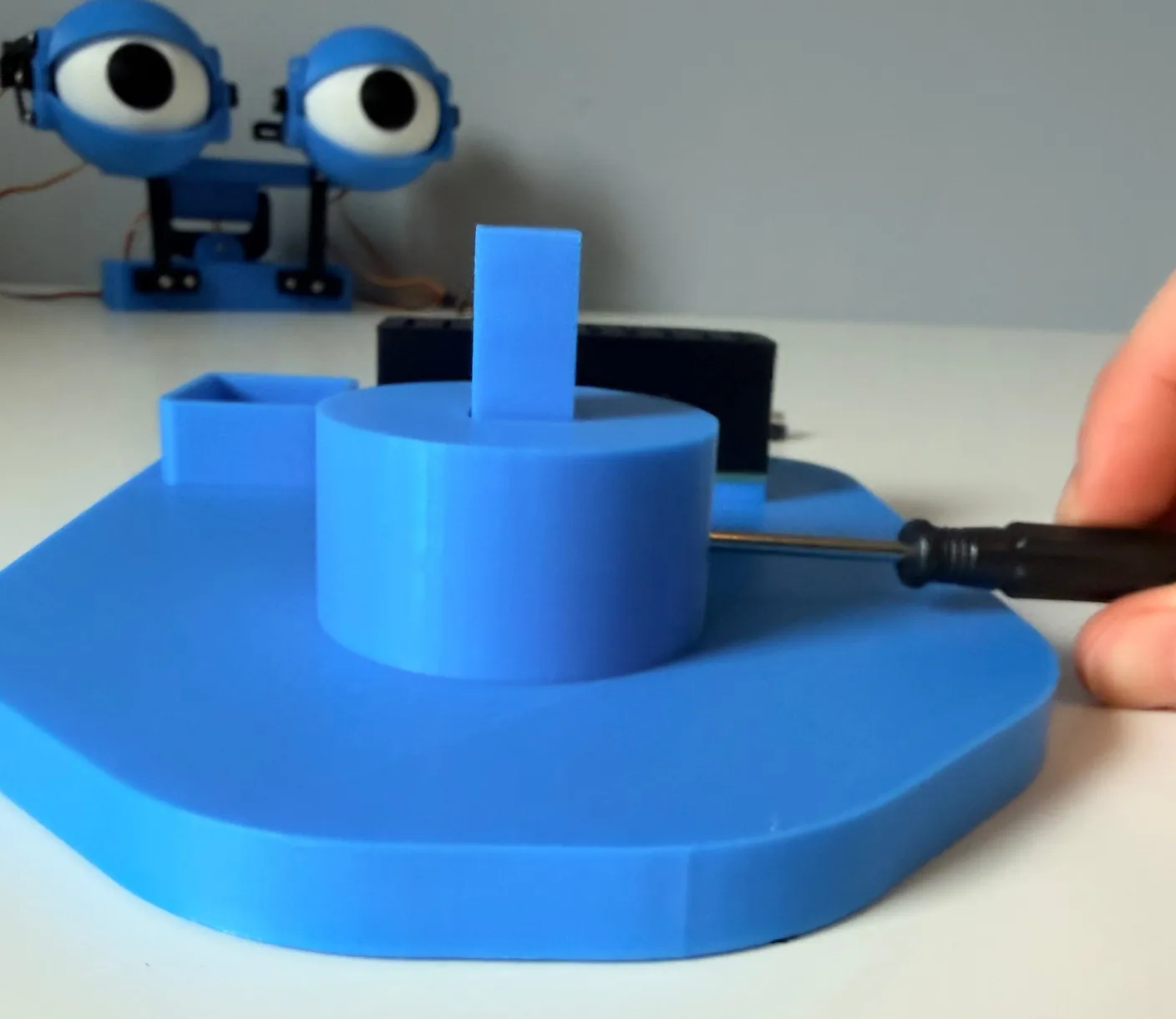 Robotic Eyes build — Assemble the Base: Tighten the screw all the way.