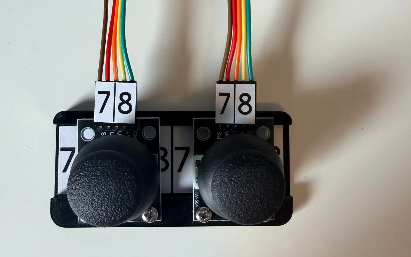 Robotic Eyes build — Wire it up: Connect the wires to the joystick by matching the numbers, as shown below.