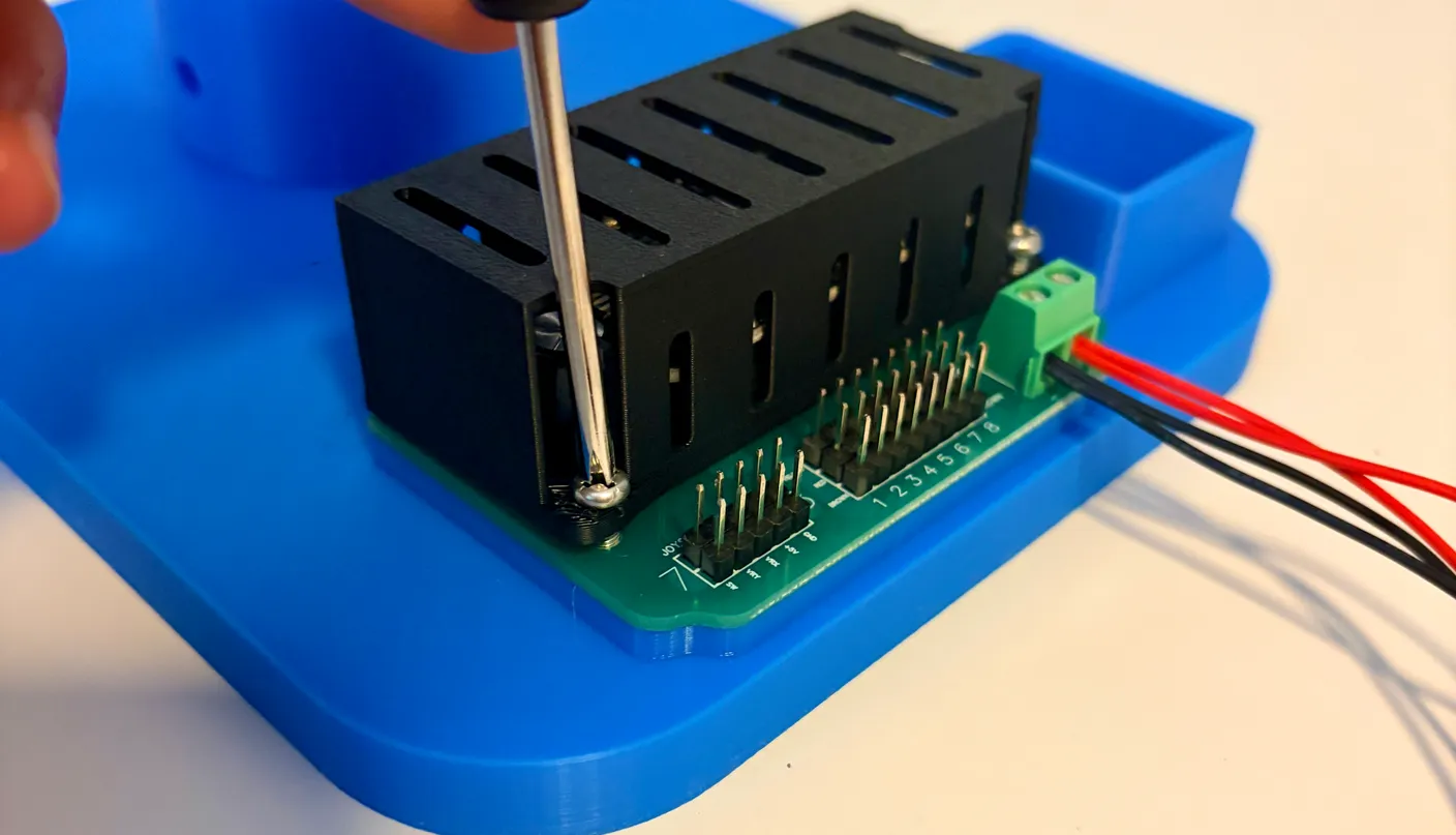 Robotic Eyes build — Swap from Joystick to Wireless: Screwing the control board back into the base.